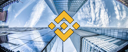 Binance logo met gebouwen op de achtergrond